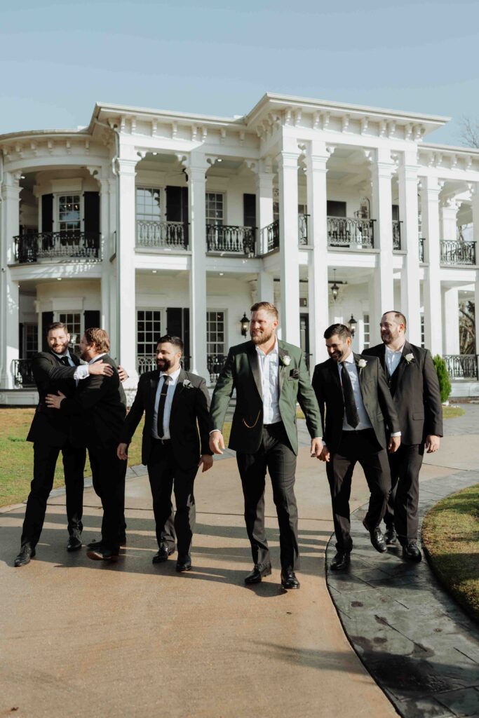 groom getting ready in manor houst at Sandlewood Manor houston wedding photographer