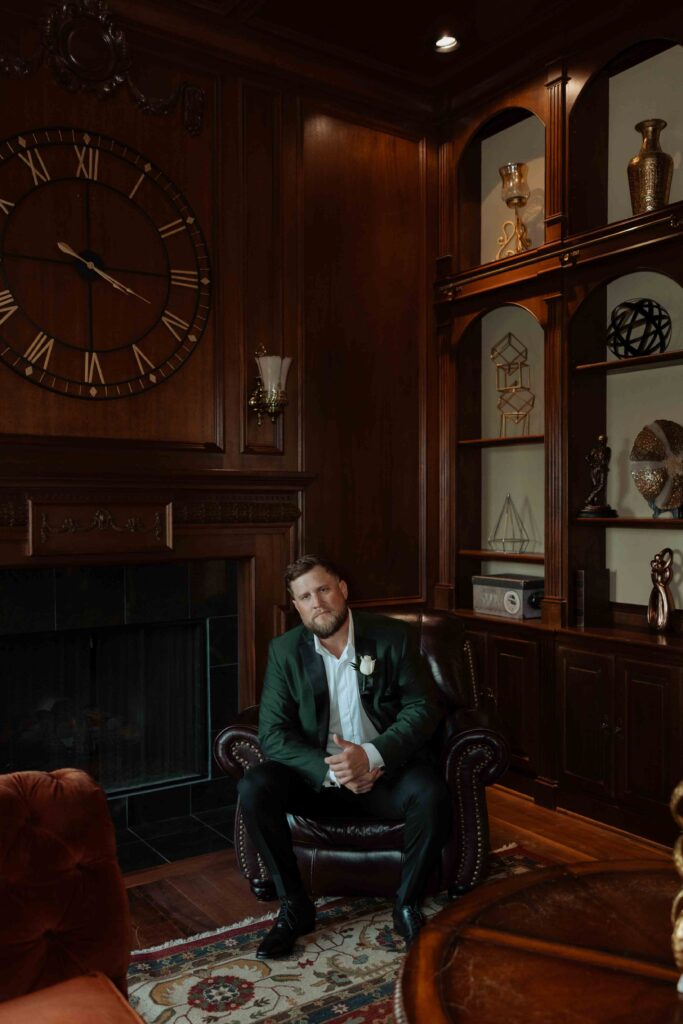 groom getting ready in manor houst at Sandlewood Manor houston wedding photographer